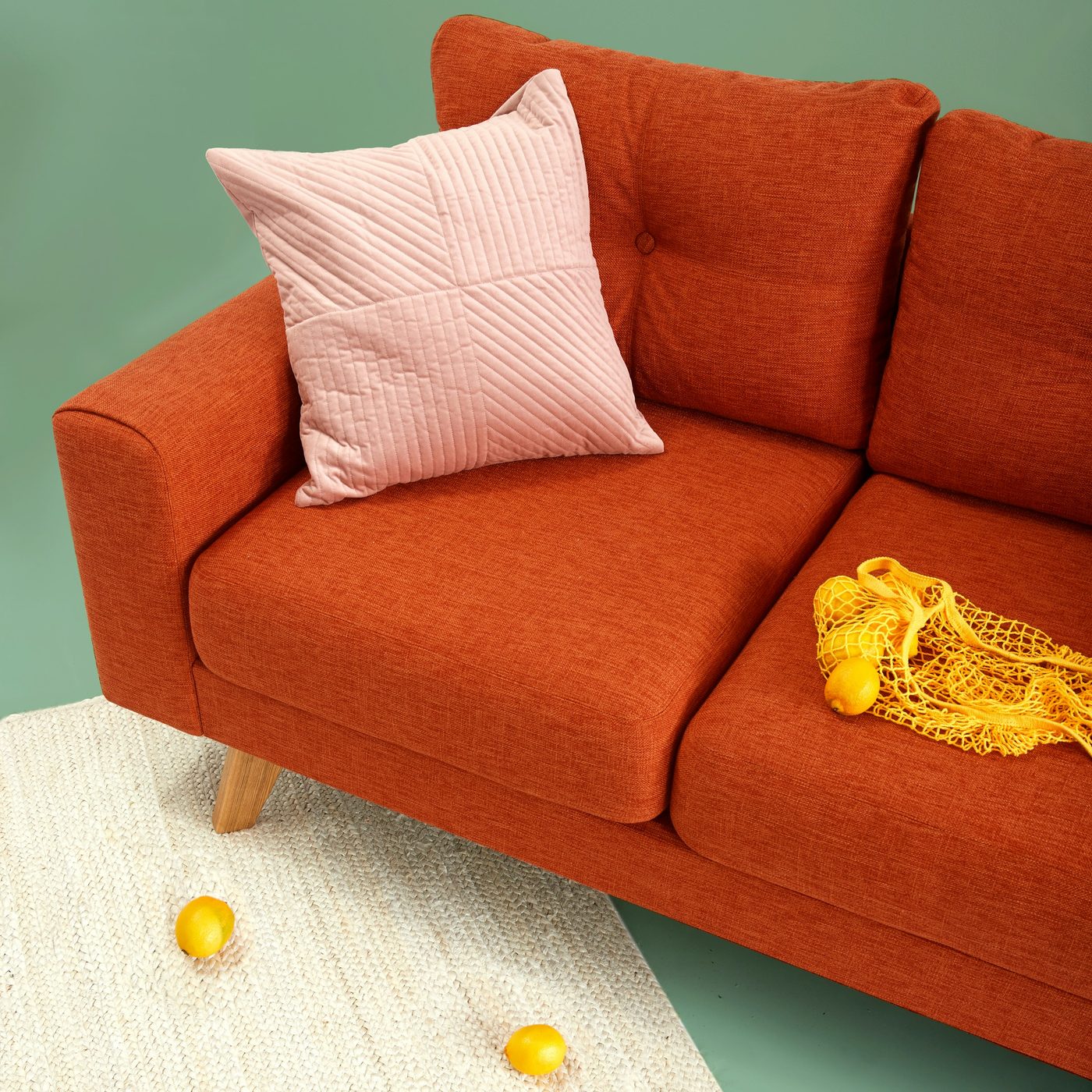 Warm amber sofa with soft cushions